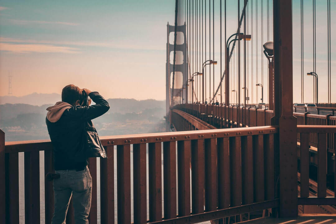 photo of tourists at golden gate bridge