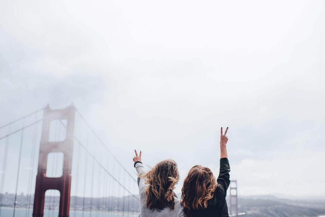 photo of tourists at golden gate bridge